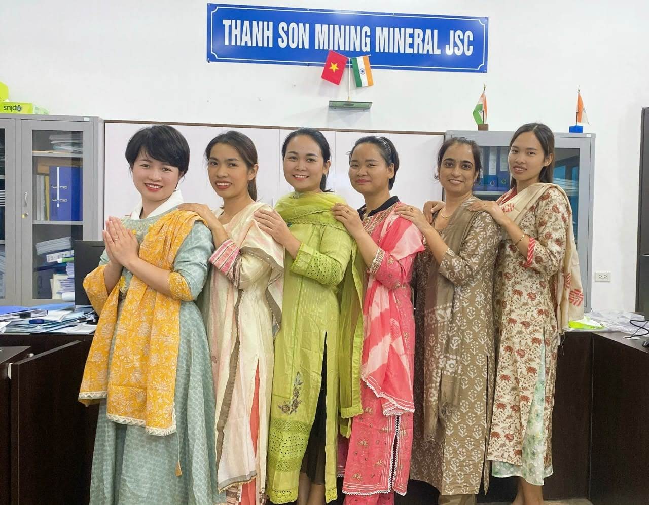 Group of women in traditional attire at Thanh Son Mining Mineral JSC office