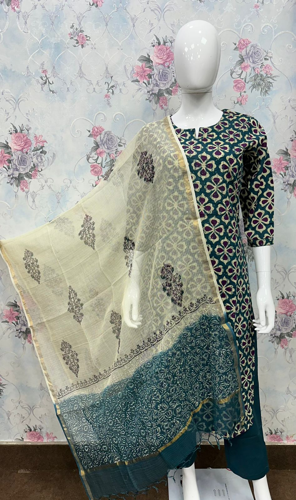 Woman wearing a blue kurti with geometric patterns